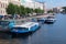 A promenade excursion boat ÑÑ‚Ð°Ð½Ð´ at the embankment of the Fontanka River near Anichkov Bridge